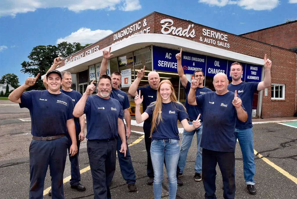 A group of cheering employee-owners